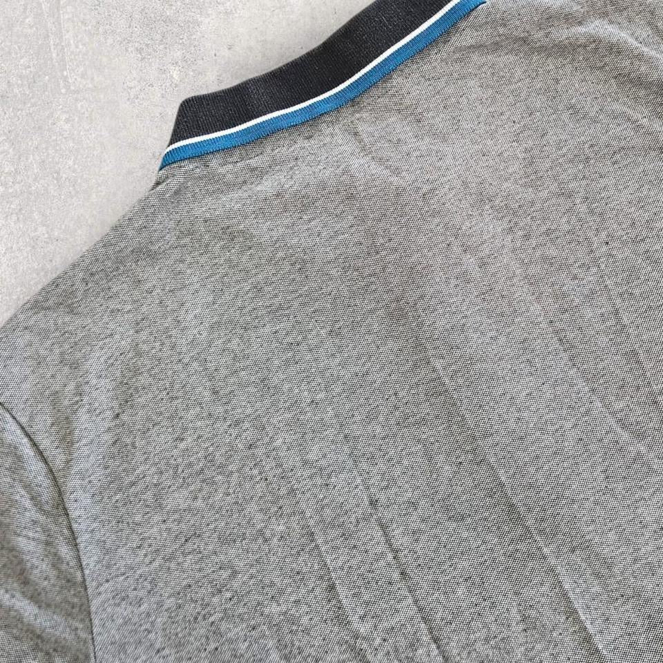 Grey Logo Polo Tee - XL Lizard Vintage Clothes Grey Logo Polo Tee - XL 65.00 NIS