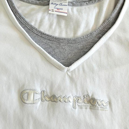 Vintage Champion Woman’s White T-shirt - S T-Shirts 65.00 NIS Vintage Champion Woman’s White T-shirt - S Lizard Vintage Clothes
