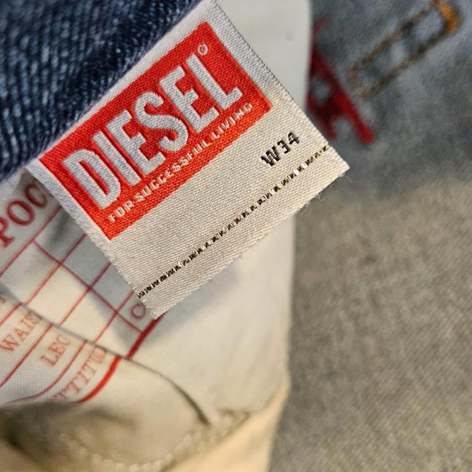 Vintage Diesel blue jeans size 34 with front mark and heavy fade