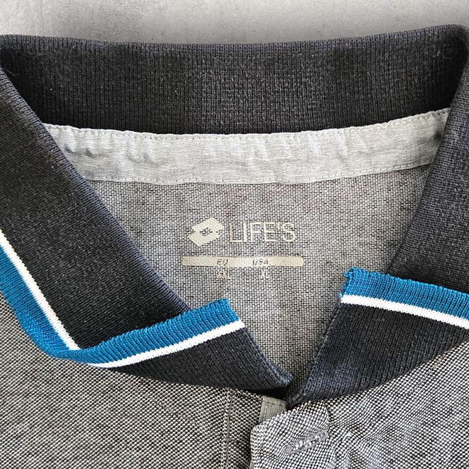 Grey Logo Polo Tee - XL Lizard Vintage Clothes Grey Logo Polo Tee - XL 65.00 NIS