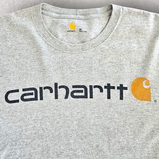 Carhartt Logo Grey T-shirt - XXL Carhartt Logo Grey T-shirt - XXL 110.00 NIS Lizard Vintage Clothes T-Shirts