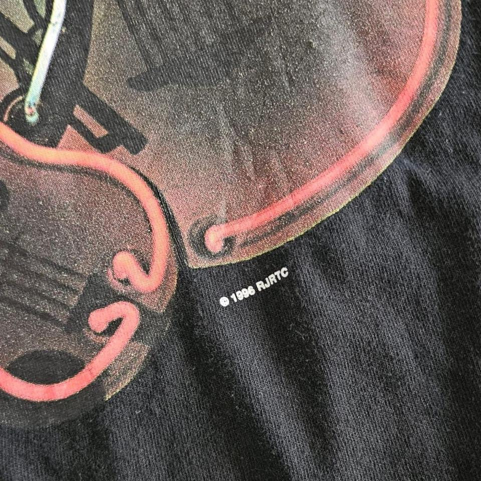 Vintage 1996 Black Pocket T-shirt - L T-Shirts 90.00 NIS Vintage 1996 Black Pocket T-shirt - L Lizard Vintage Clothes