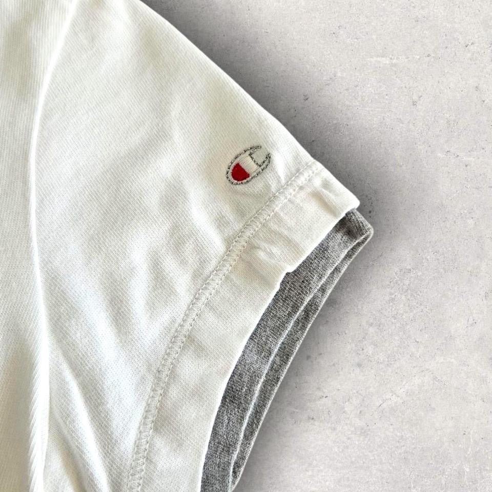 Vintage Champion Woman’s White T-shirt - S T-Shirts 65.00 NIS Vintage Champion Woman’s White T-shirt - S Lizard Vintage Clothes