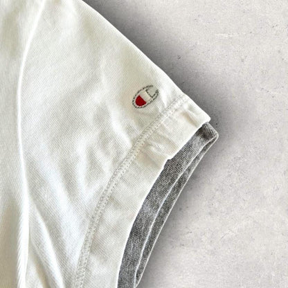Vintage Champion Woman’s White T-shirt - S T-Shirts 65.00 NIS Vintage Champion Woman’s White T-shirt - S Lizard Vintage Clothes