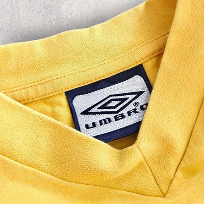 Umbro Vintage V-neck yellow T-shirt - M 55.00 NIS Umbro Vintage V-neck yellow T-shirt - M Lizard Vintage Clothes T-Shirts
