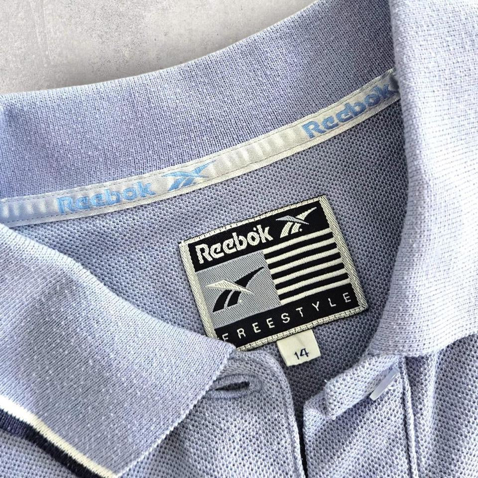 Vintage Reebok Reworked Polo Tee - S Vintage Reebok Reworked Polo Tee - S 75.00 NIS Lizard Vintage Clothes Polos