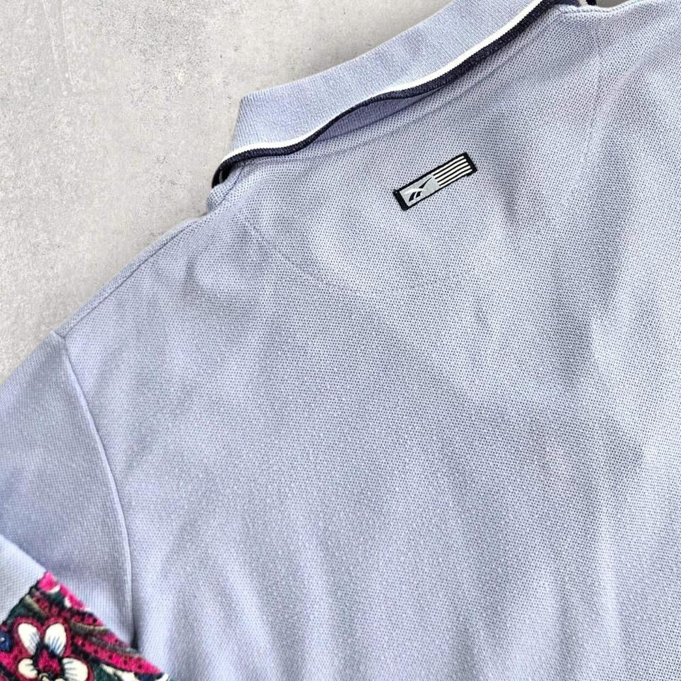 Vintage Reebok Reworked Polo Tee - S Vintage Reebok Reworked Polo Tee - S 75.00 NIS Lizard Vintage Clothes Polos