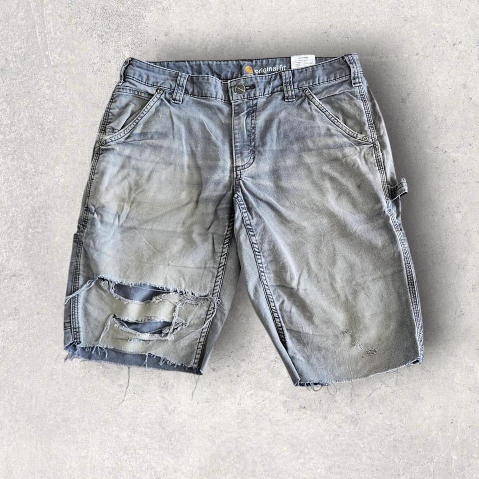 Carhartt grey carpenters pants with ripped front and distressed marks