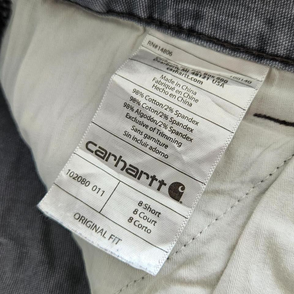 Carhartt grey carpenters pants with ripped front and distressed marks
